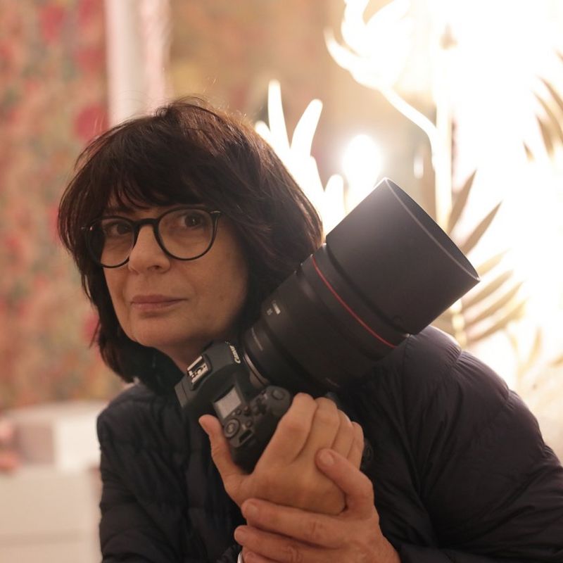 Canon RF 85mm F1.2L USM DS Lens A Woman Holding a Camera