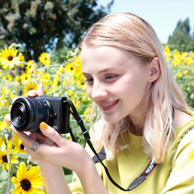 Canon EOS M200 Interchangeable Lens Live Streaming Kit A Woman Taking a Photo in a Field