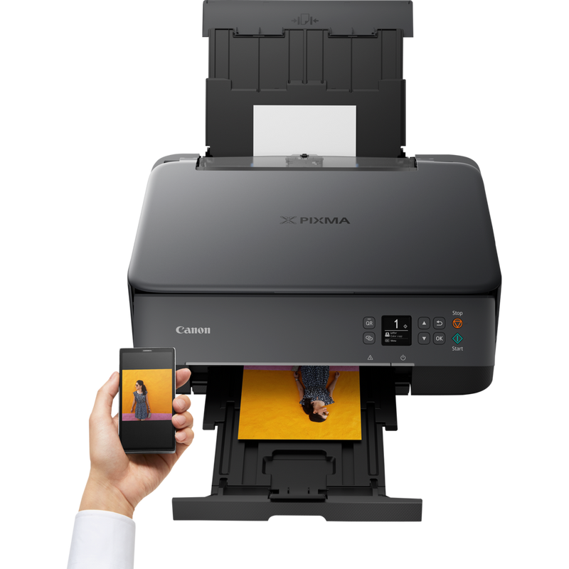Canon PIXMA TS5350 Wireless Colour All in One Inkjet Photo Printer, Black Product Front View With A Person Printing From a Smartphone