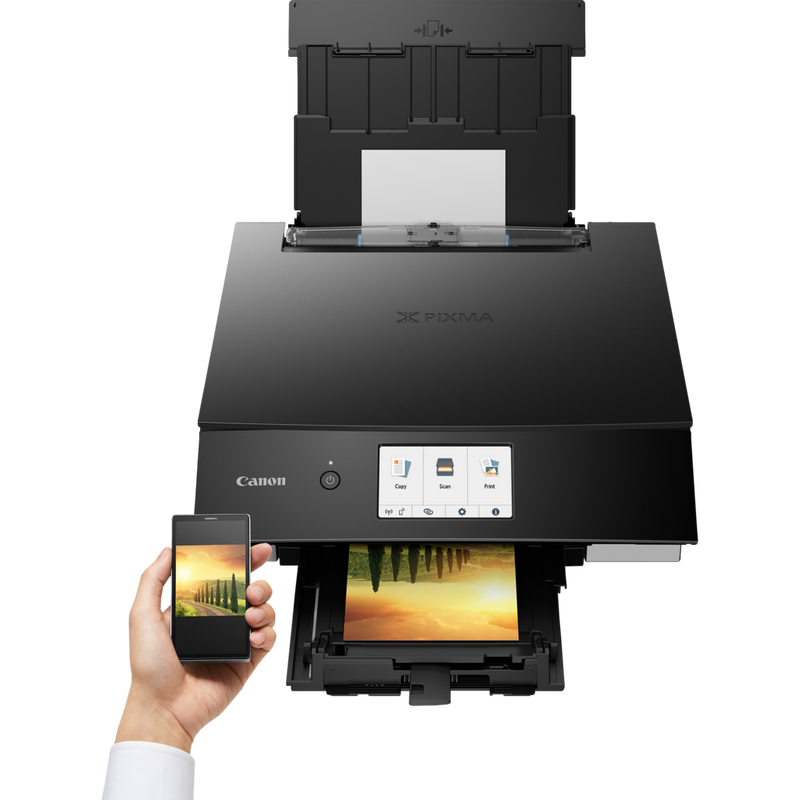 Canon PIXMA TS8350 Wireless Colour All in One Inkjet Photo Printer, Black Product Front View With A Person Printing From a Smartphone
