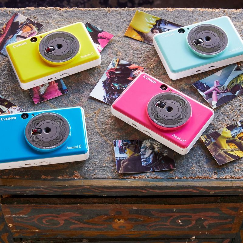 Canon Zoemini C Instant Camera Colour Photo Printer, Bumblebee Yellow 4 Printers displayed on desk with photos