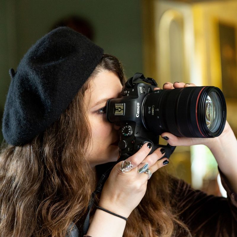 Canon EOS R6 Mirrorless Camera + RF 24-105mm F4-7.1 IS STM Lens A Woman Holding the Camera to Her Face