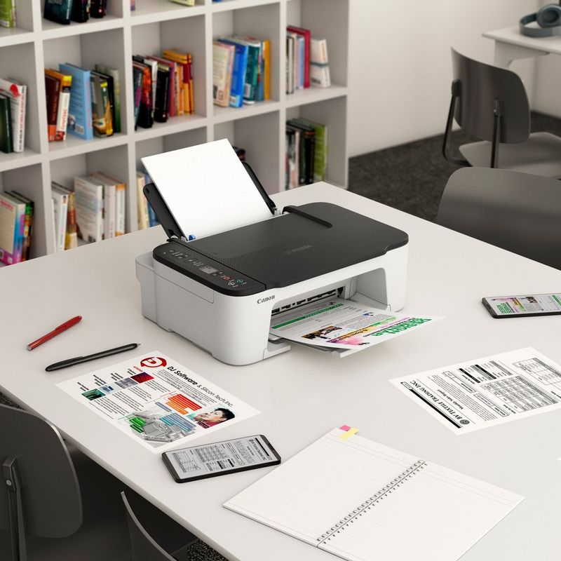 Canon PIXMA TS3452 Wireless Colour All-in-One Inkjet Photo Printer, White with Black top Kept On A Table With Paper Tray Out And Paper Support