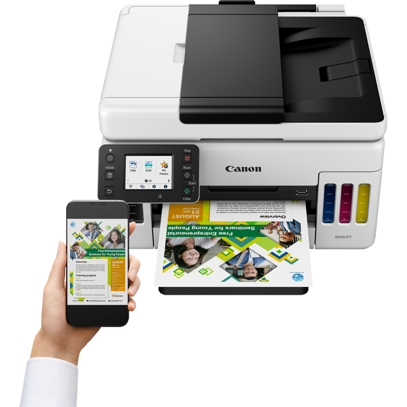 Canon MAXIFY GX6040 Wireless Colour 3-in-1 Refillable MegaTank Inkjet Printer Product Front View With A Person Printing From a Smartphone