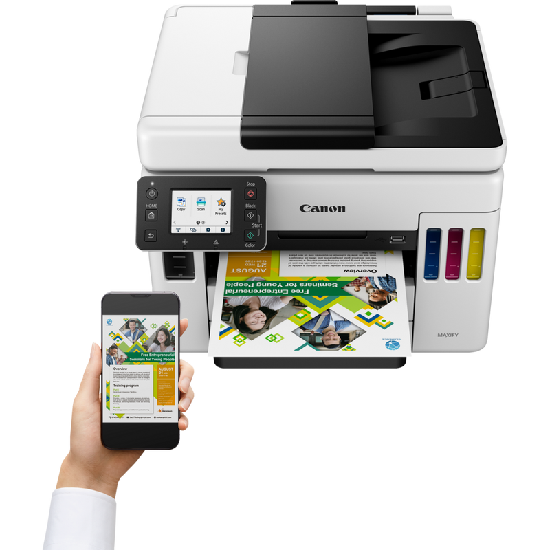 Canon MAXIFY GX7040 Wireless Colour All-in-one Refillable MegaTank Inkjet Printer Product Front View With A Person Printing From a Smartphone