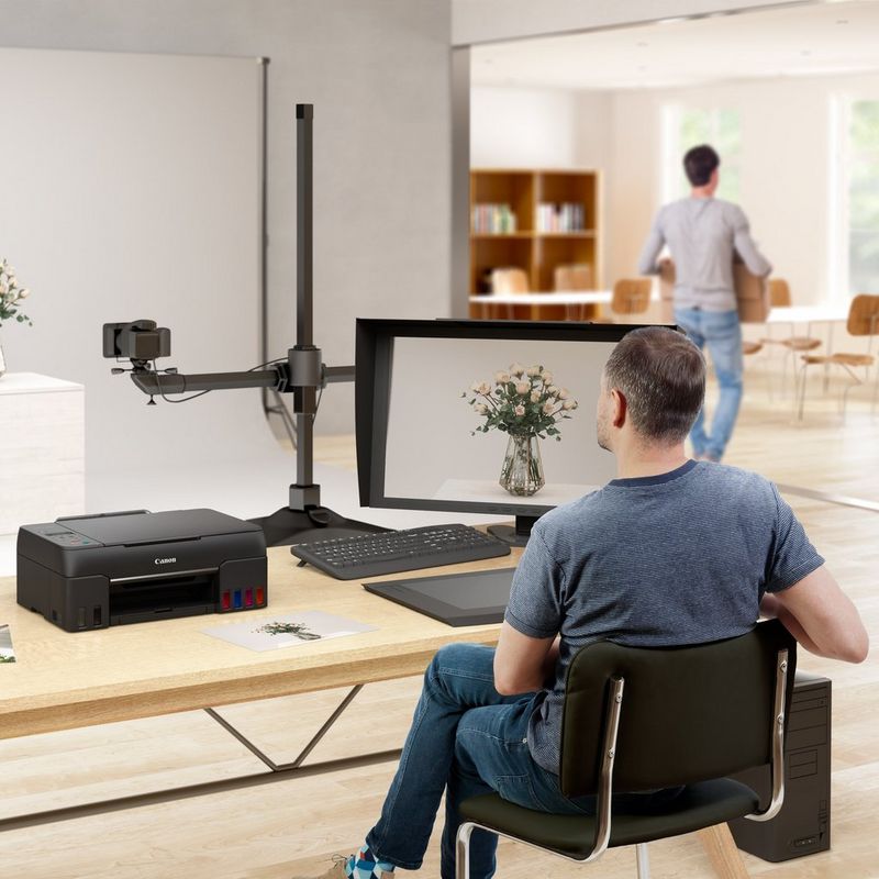 Canon PIXMA G640 Wireless 3-in-1 Refillable MegaTank Inkjet Photo Printer Product Being Used In a Studio