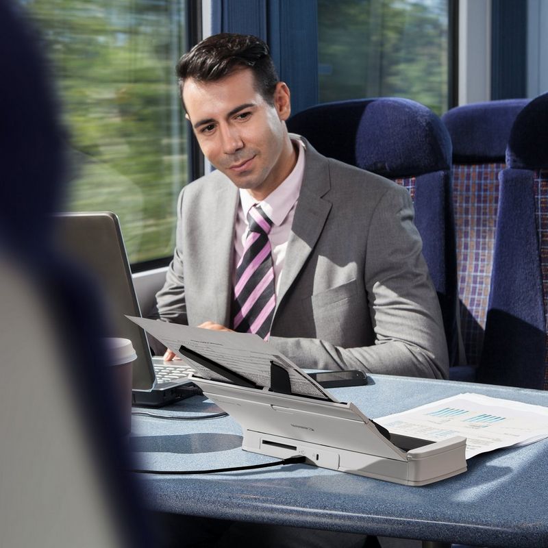 Canon imageFORMULA R10 Portable Scanner Product Person using the Scanner in a moving train