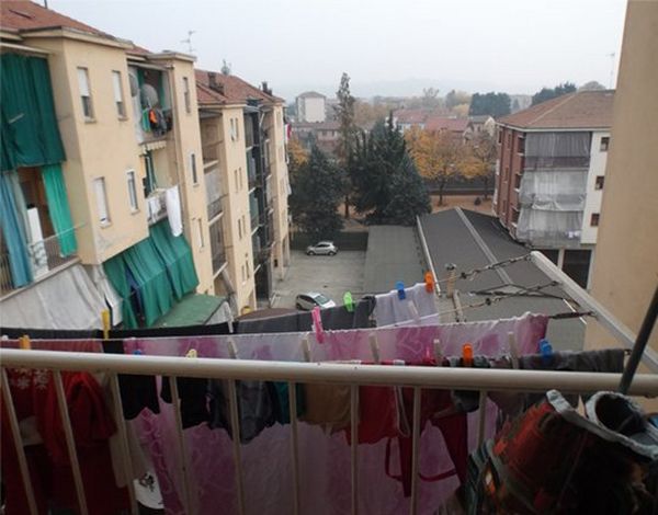 Laundry hanging on an apartment balcony