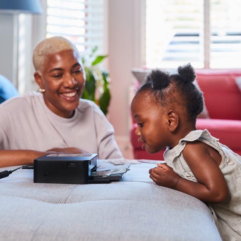 Canon SELPHY CP1500 Colour Portable Photo Printer Paper Kit, Women and Child operating the Printer