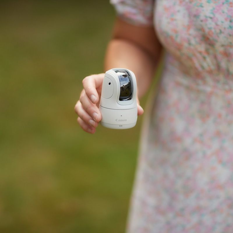 Canon PowerShot PX Compact Concept Camera Essential Kit, White A kid looking at the camera