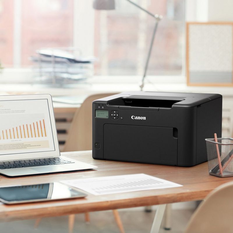Canon i-SENSYS LBP122dw Single Function Mono Wireless Laser Printer Kept on the table next to a laptop