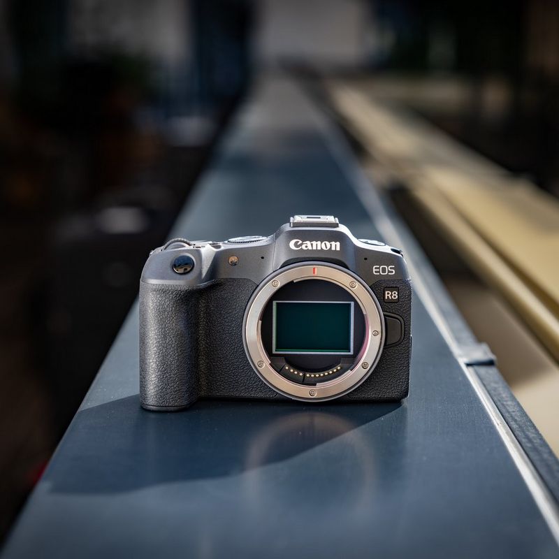 Canon EOS R8 Mirrorless Camera + Spare Battery camera in dark background