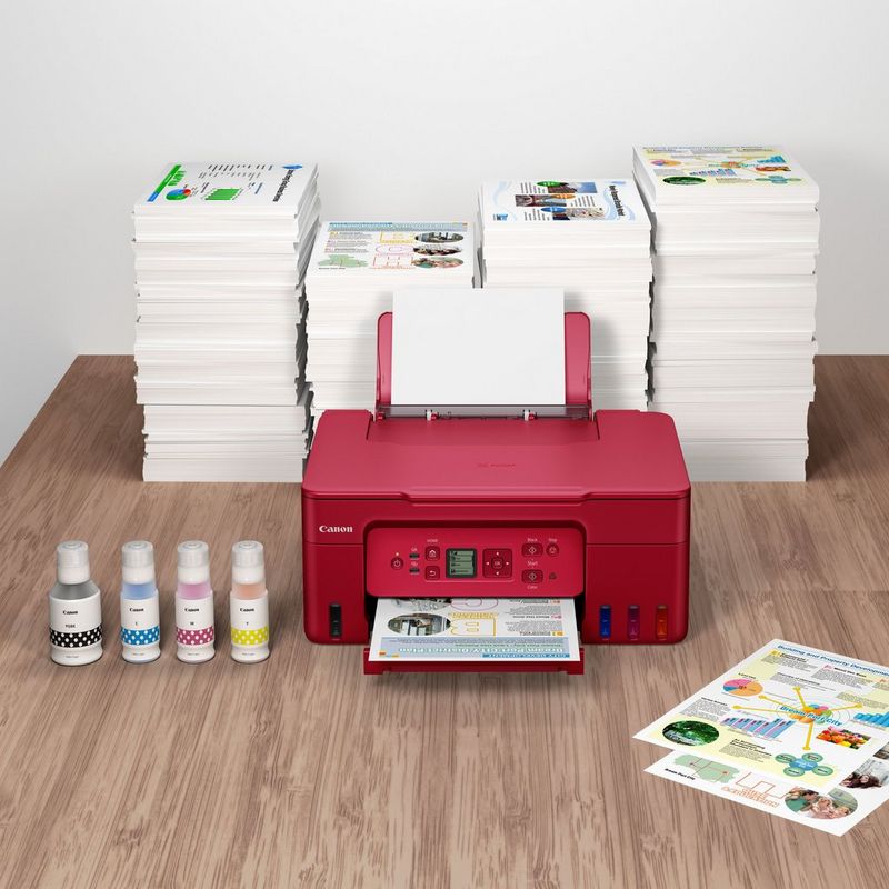 Canon PIXMA G3572 Wireless Colour 3-in-1 Refillable MegaTank Printer, Red Product kept with a stack of papers