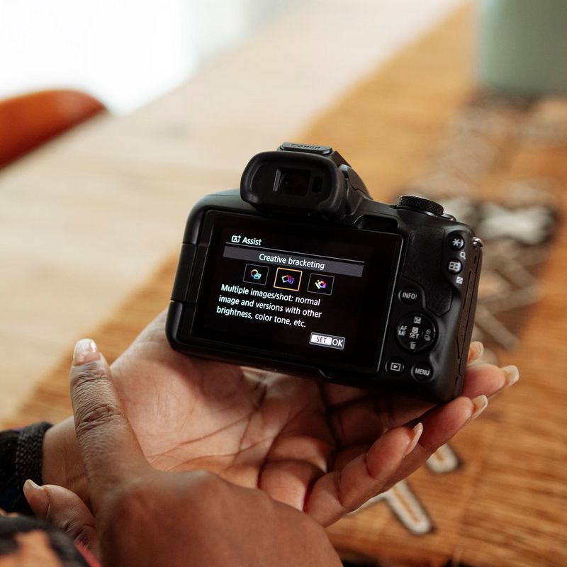 Canon EOS R50 Mirrorless Camera, Black + RF-S 18-45mm IS STM Lens + RF-S 55-210mm IS STM Lens Browsing the menu on screen