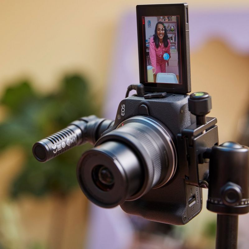 Canon EOS R50 Mirrorless Camera, Black + RF-S 18-45mm F4.5-6.3 IS STM Lens + Backpack + SD Card + Spare Battery Product attached to Tripod