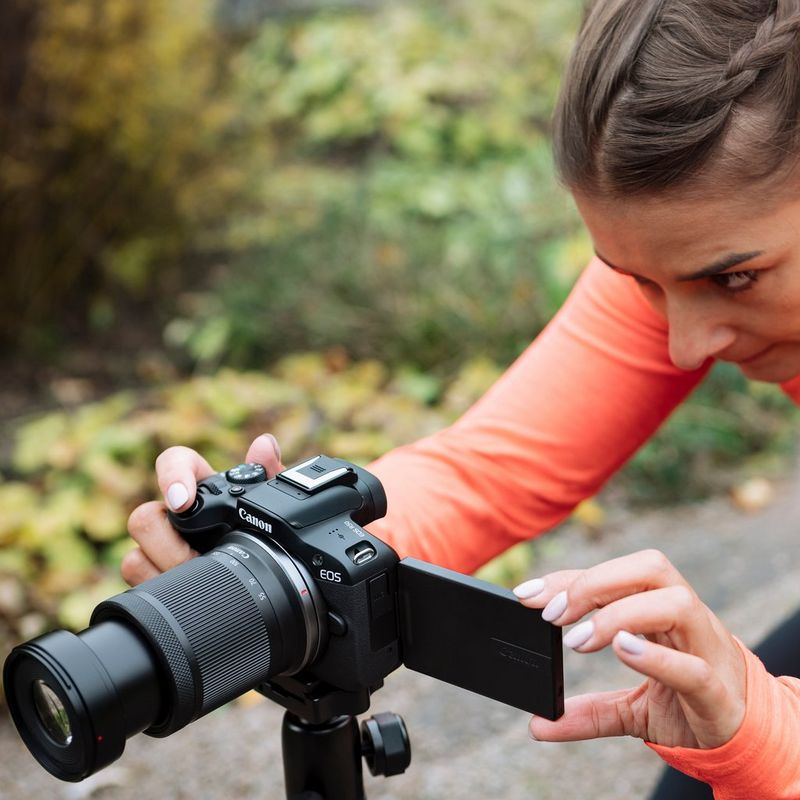 Canon RF-S 55-210mm F5-7.1 IS STM Lens Women clicking a photo on a road