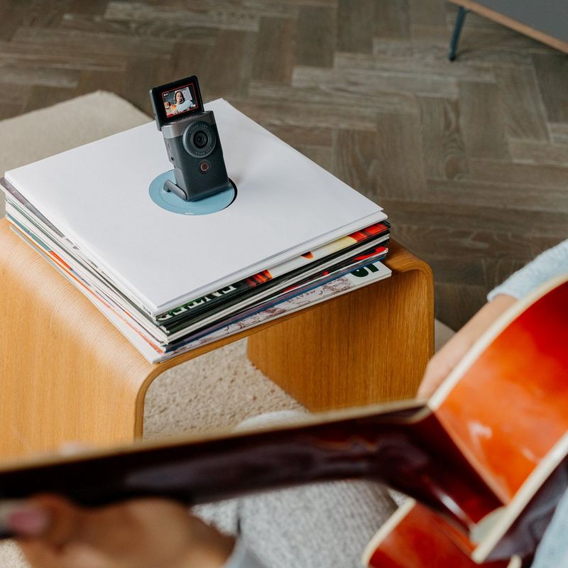 Woman vlogging with product on a table