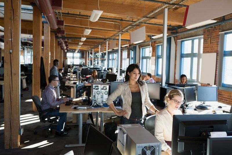 a group of people working in an office