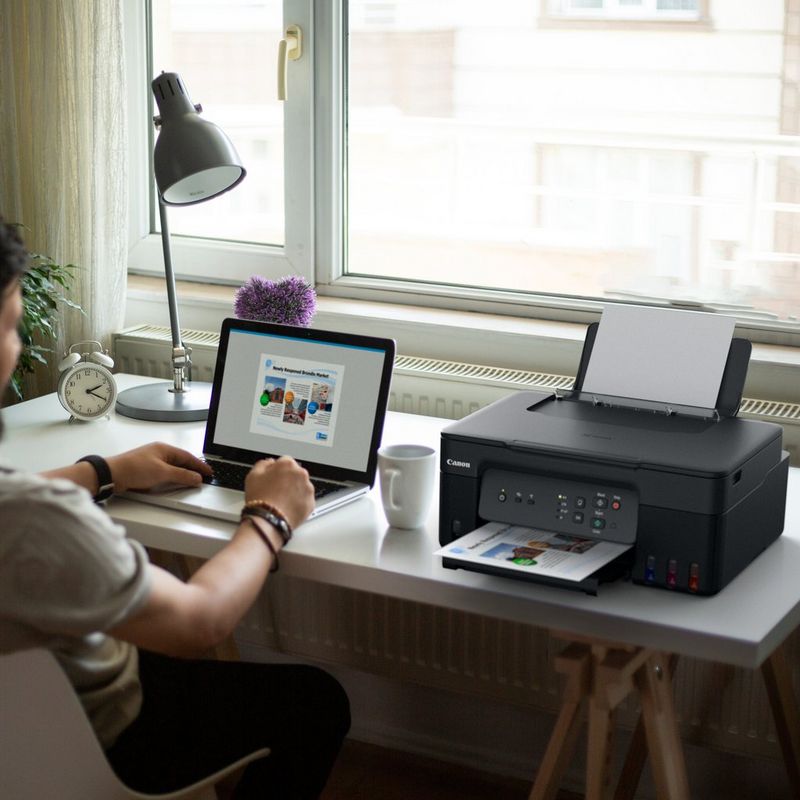 Canon PIXMA G3430 Wireless Colour 3-in-1 Refillable MegaTank Printer user printing a document using his laptop
