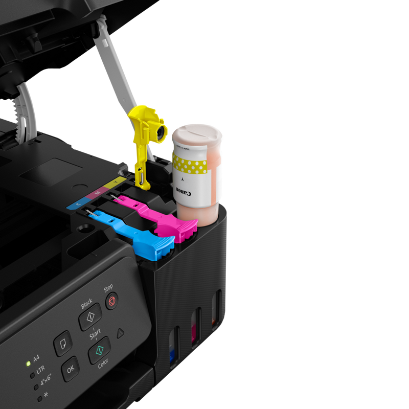 Canon PIXMA G2430 Colour 3-in-1 Refillable MegaTank Printer user refilling the yellow ink tank using the ink bottle