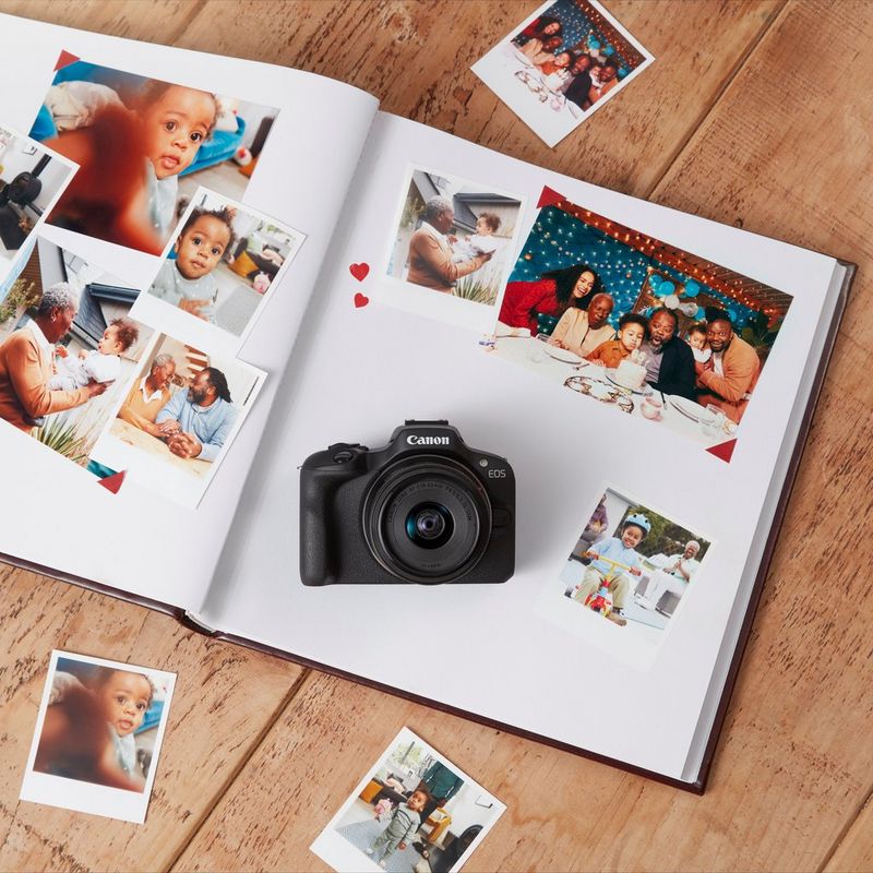 Canon EOS R100 Mirrorless Camera Product on top of photo album