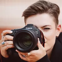 Canon EOS R1 Mirrorless Camera Body Women clicking a photo