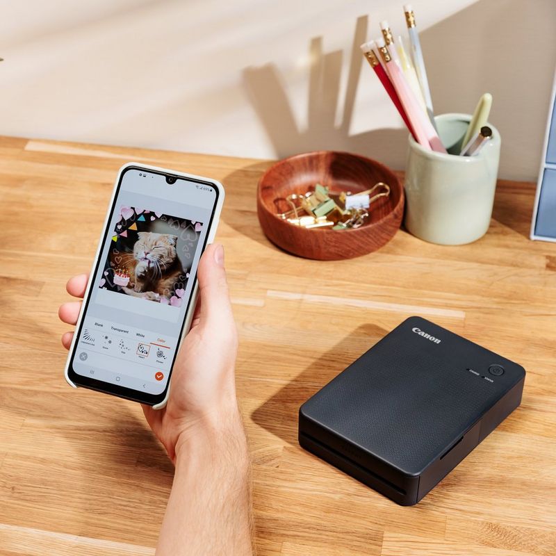 Kannettava ja langaton Canon SELPHY SQUARE QX10 -värivalokuvatulostin, tummanharmaa  Tuote käyttää puhelinyhteyttä