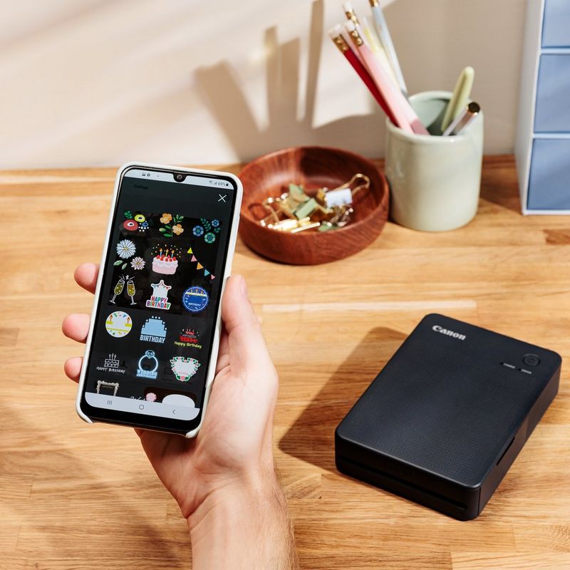 Kannettava ja langaton Canon SELPHY SQUARE QX10 -värivalokuvatulostin, tummanharmaa  Tuote käyttää puhelinyhteyttä