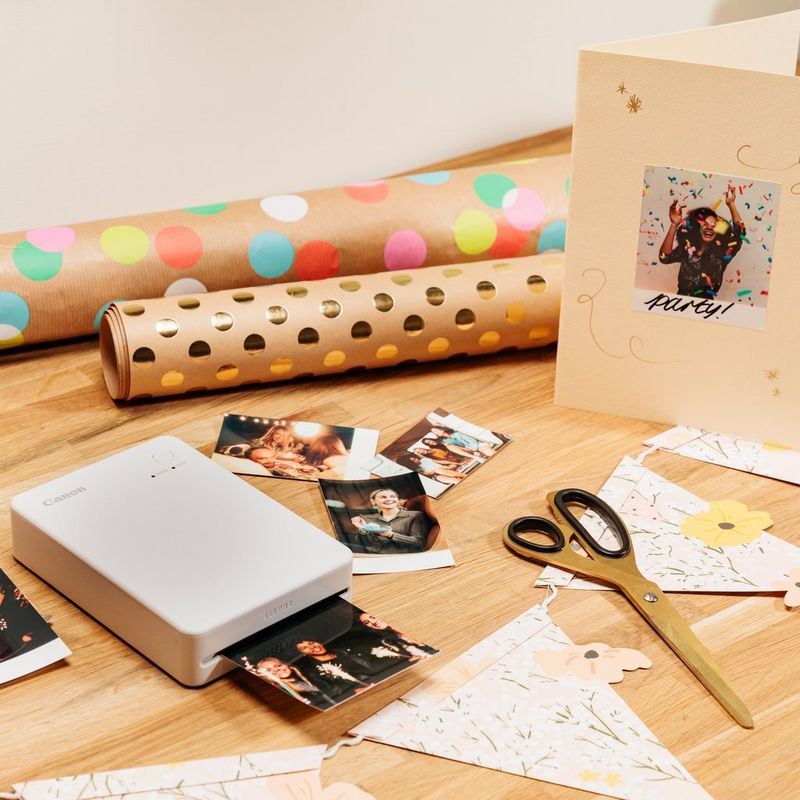 Canon SELPHY QX20 Portable Colour Photo Wireless Printer, Sand White Product lying on table