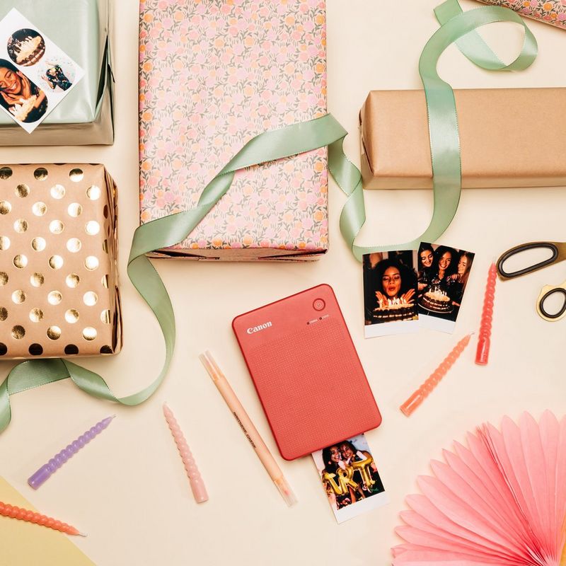 Canon SELPHY QX20 Portable Colour Photo Wireless Printer, Terracotta Red Product lying on table