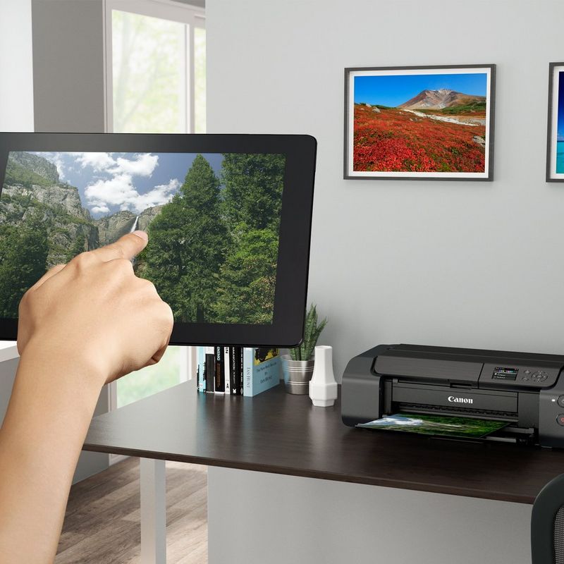 Canon PIXMA PRO-200S A3 Plus Colour Photo Wireless Printer Product Front View With A Person Printing From a Tablet