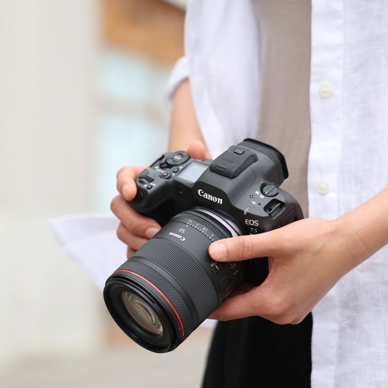 Canon RF 50mm F1.4L VCM Lens Prodcuct held by a man