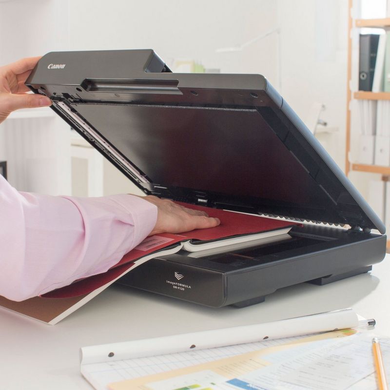 Canon imageFORMULA DR-F120 Flatbed Document Scanner Product Person using the product kept on a desk