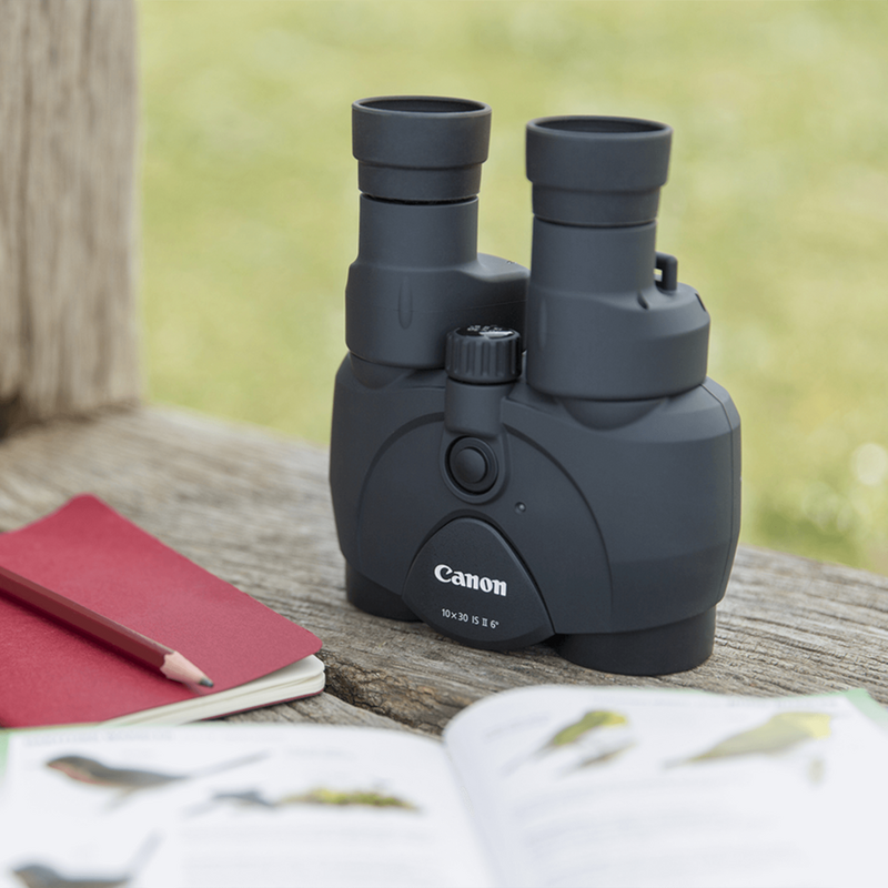 Canon 10x30 IS II Binoculars Binoculars Standing on a Wooden Surface