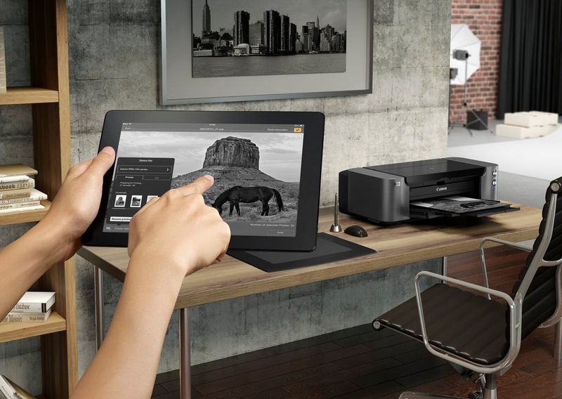 Canon PIXMA PRO-10S A3 Plus Colour Photo Wireless Printer Product Front View With A Person Printing From a Smart Device