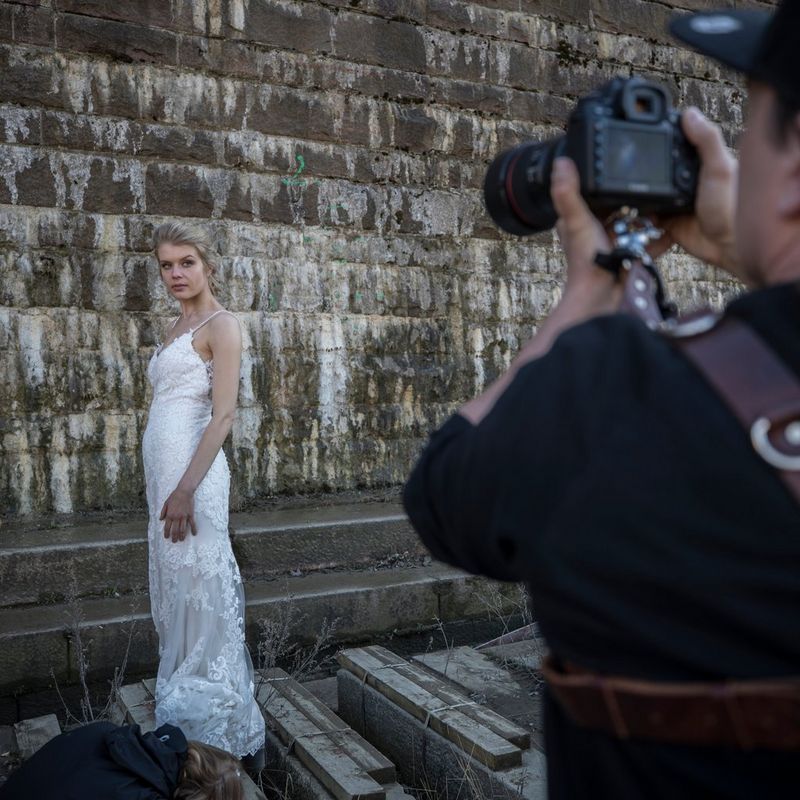 Photographer taking a picture of the bride