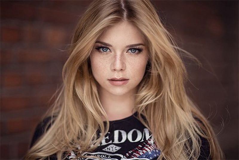 A dark, moody portrait shows a man dressed as Wolverine from the X-Men films.