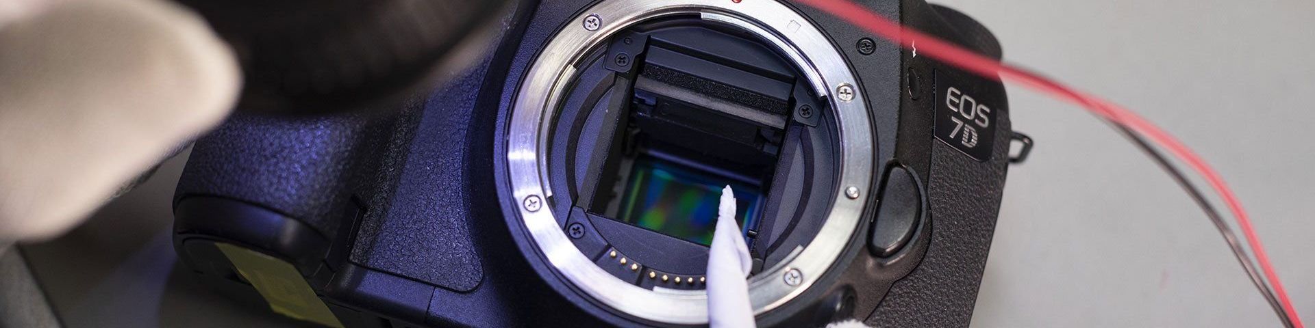 A close-up of a Canon EOS 7D body showing the sensor inside