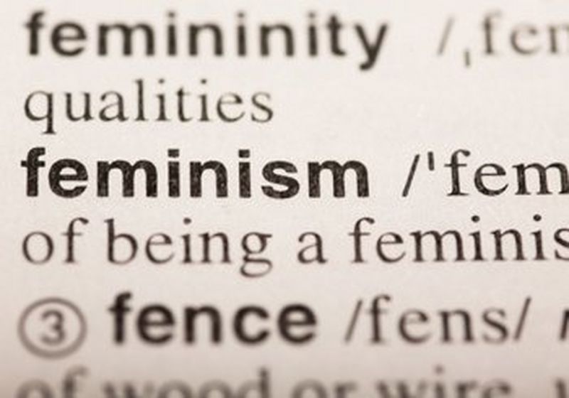 A close up photo of the dictionary definition of feminism. The words shown on the centre line are are ‘Feminism/’femi’. The line below shows the words ‘of being a feminist’.