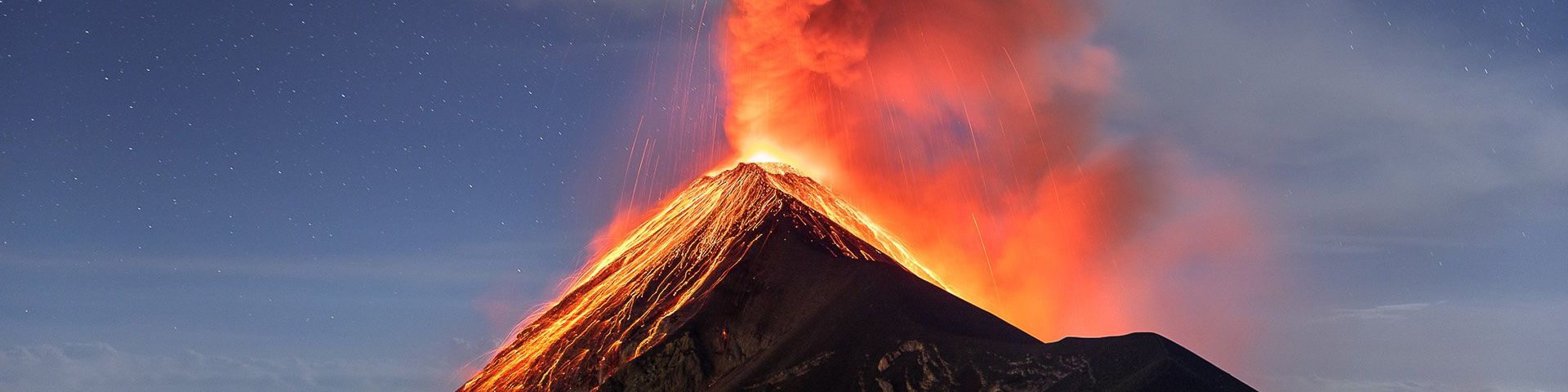 Volcano Fuego spits ash and red-hot lava into the sky.