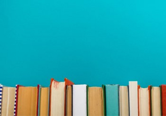A row of books against a blue background
