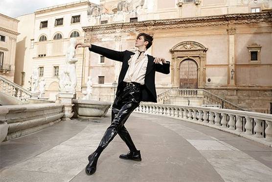 Ballet dancer Lee Jay Hoy poses in front of classical buildings in Palermo, Sicily.