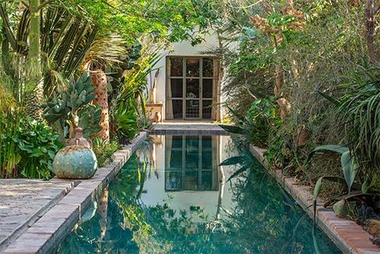 A reflection pool lined with exotic succulents at an eco-garden lodge in Taroudant, Morocco. 