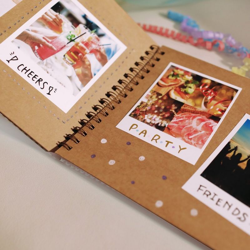 Canon SELPHY SQUARE QX10 Portable Colour Photo Wireless Printer, White Photo Album on a Desk