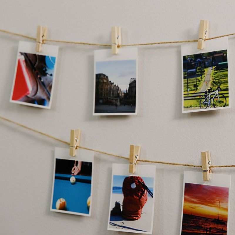 Canon SELPHY SQUARE QX10 Portable Colour Photo Wireless Printer, Black Photos hanging with Pins