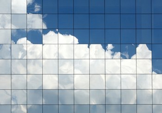 Clouds reflected in glass windows.
