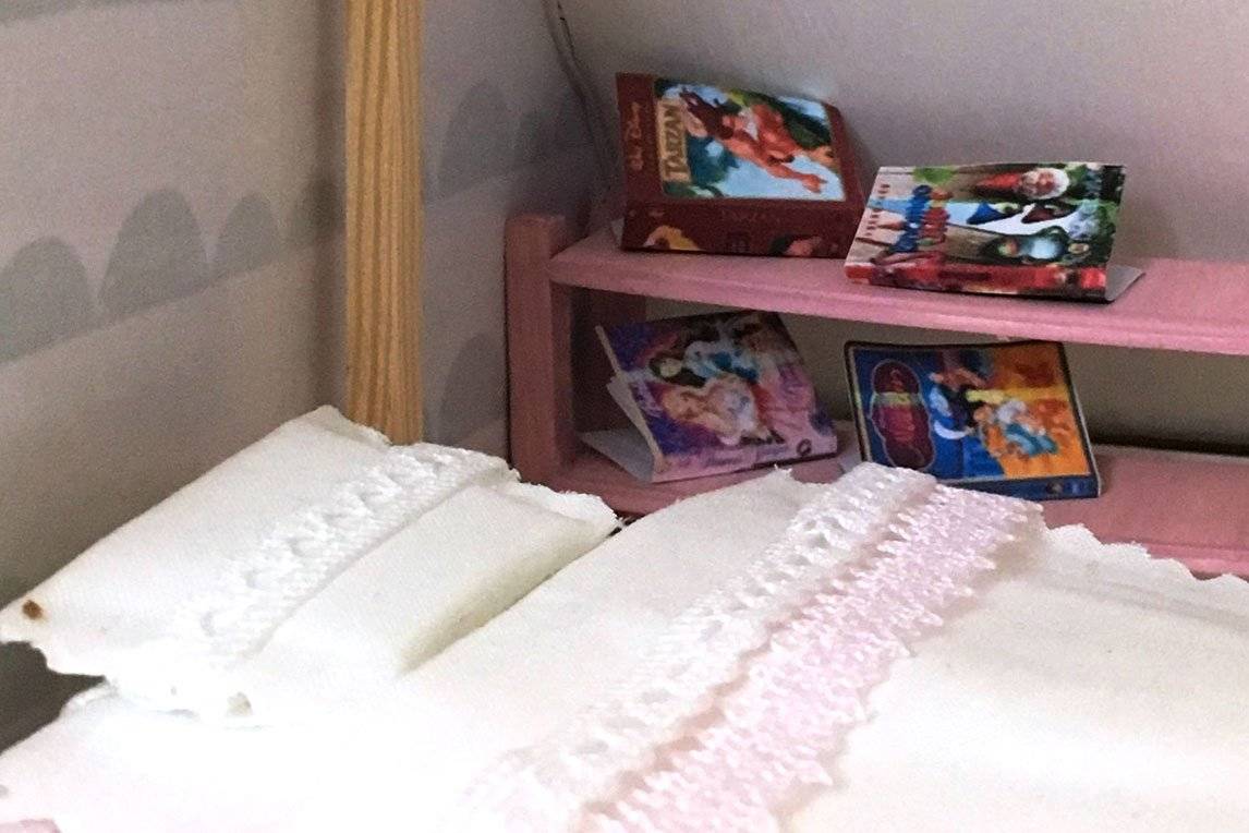 Bed with pictures beside