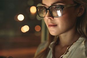 woman glasses gazing screen