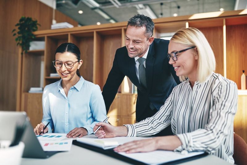 work professionals reviewing documents.