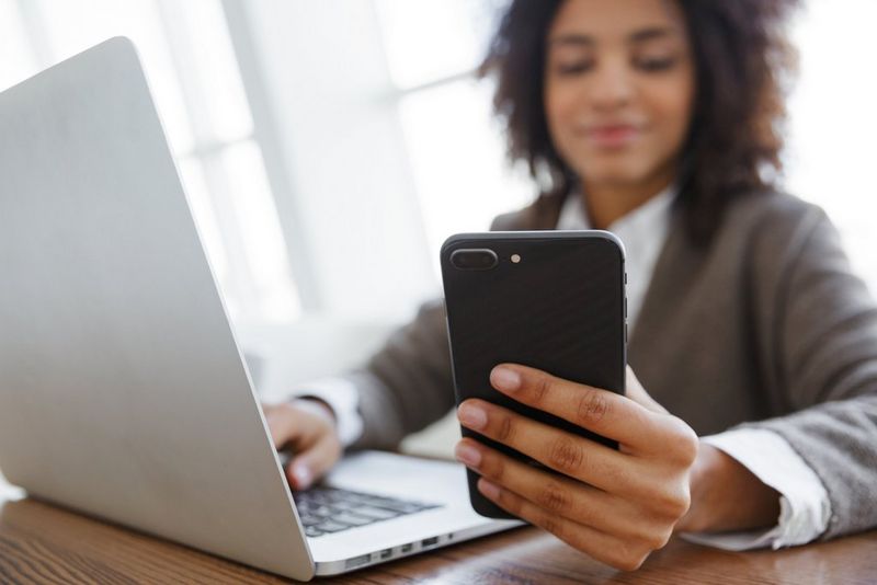 a woman looking at her smartphone